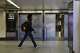 A pedestrian walks past closed off tracks inside Penn Station on the first day of a Long Island Rail Road strike, Saturday, May 16, 2026, in New York.