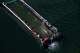 The humpback whale, stranded in the Baltic Sea, arrived in the barge intended for its transport near the island of Poel, Germany, Tuesday, April 28, 2026. (Stefan Sauer/dpa via AP)