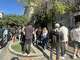 A crowd of people wait outside of the Galleria in anticipation of a limited edition Swatch collection. The store shut down Saturday morning due to safety concerns.