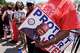 A protestor holds a sign of the late Georgia Congressman John Lewis during a voting rally, Saturday, May 16, 2026, in Montgomery, Ala.