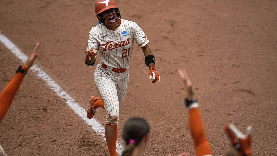 Texas Longhorns outfielder Kayden Henry (21) celebrates a final home run during the NCAA Softball Championship Regional game against Wisconsin at Red & Charline McCombs Field on Saturday, May 16, 2026 in Austin.