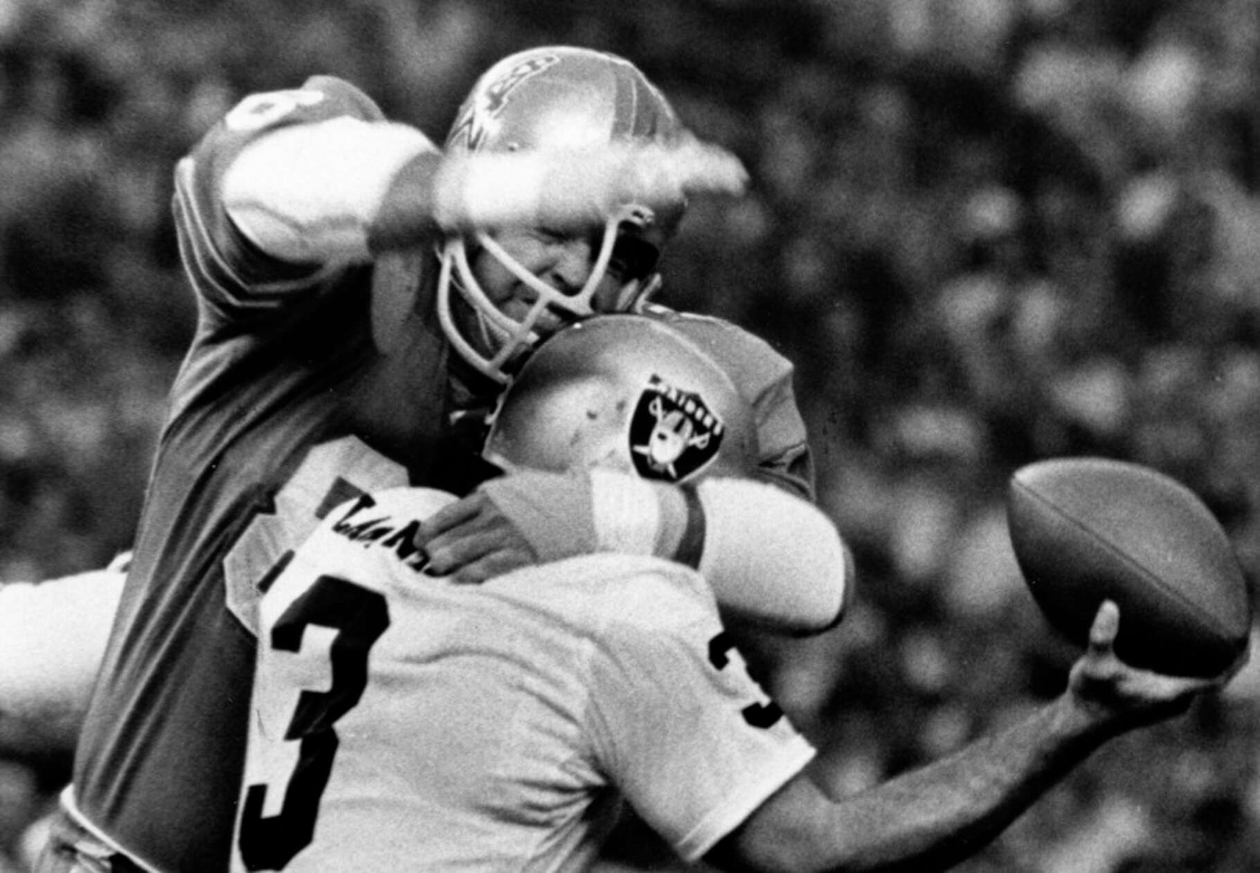 09/29/1968 - Houston Oilers Gary Cutsinger puts hammer lock on Oakland Raiders quarterback Daryle LaMonica (3) for loss in first quarter in Astrodome.