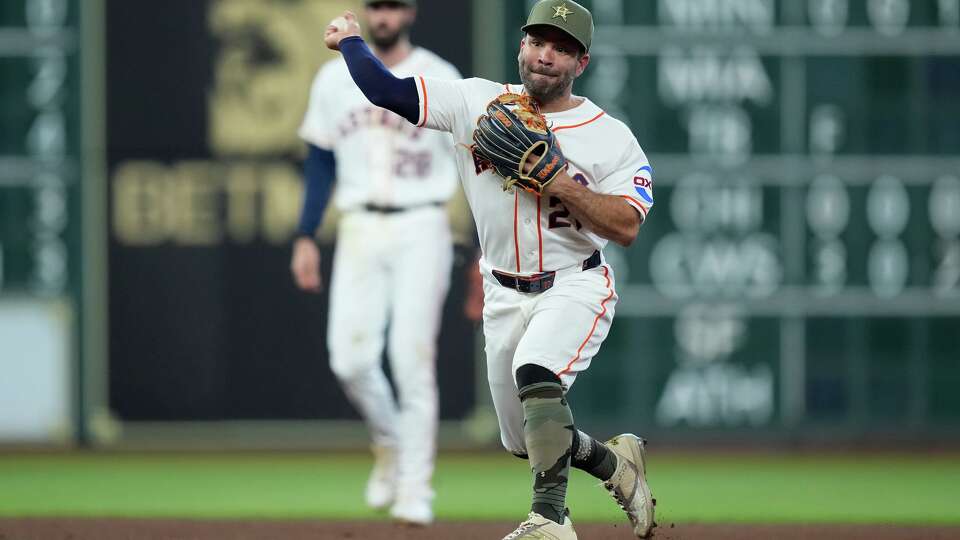 Houston Astros second baseman Jose Altuve throws to first base for an out during the fourth inning of a baseball game against the Texas Rangers, Saturday, May 16, 2026, in Houston. (AP Photo/Kevin M. Cox)