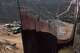 Construction crews work on a new border wall segment near the end of a previously built section on Kuuchamaa Mountain, Friday, April 24, 2026, seen from Tecate, Mexico.