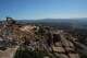 Construction crews work on a new border wall segment on Kuuchamaa Mountain, Friday, April 24, 2026, seen from Tecate, Mexico.