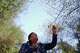 Norma Meza Calles, a Kumeyaay Nation leader, touches a branch as she leads a guided tour of traditional Kumeyaay uses for local plants at a wellness center, Friday, May 1, 2026, in Tecate, Mexico.