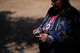 Norma Meza Calles, a Kumeyaay Nation leader, lights a bundle of white sage as she talks of the sacred importance of nearby Kuuchamaa Mountain at a wellness center Friday, May 1, 2026, in Tecate, Mexico.