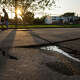 A section of broken asphalt along Surrey Square near Timber Creek is shown in need of repair on Monday, Aug. 26, 2019, in Houston. HPW director recently claimed Houston's pothole program is the best in the country.