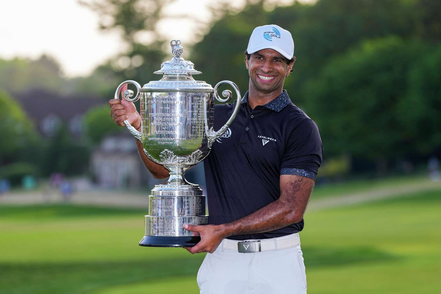 Aaron Rai, of England, holds the Wanamaker Trophy after winning the PGA Championship golf tournament at Aronimink Golf Club, Sunday, May 17, 2026, in Newtown Square, PA.