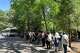 Visitors wait to board a shuttle Saturday in Yosemite National Park, where parking lots have been filling up early on weekends.