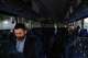 Commuters sit on a shuttle bus as Long Island Rail Road workers strike, Monday, May 18, 2026, in Mineola, N.Y.