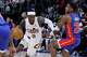 Cleveland Cavaliers guard Dennis Schroder (8) drives against Detroit Pistons guard Marcus Sasser during the second half of Game 7 in a second-round NBA basketball playoffs series, Sunday, May 17, 2026, in Detroit.