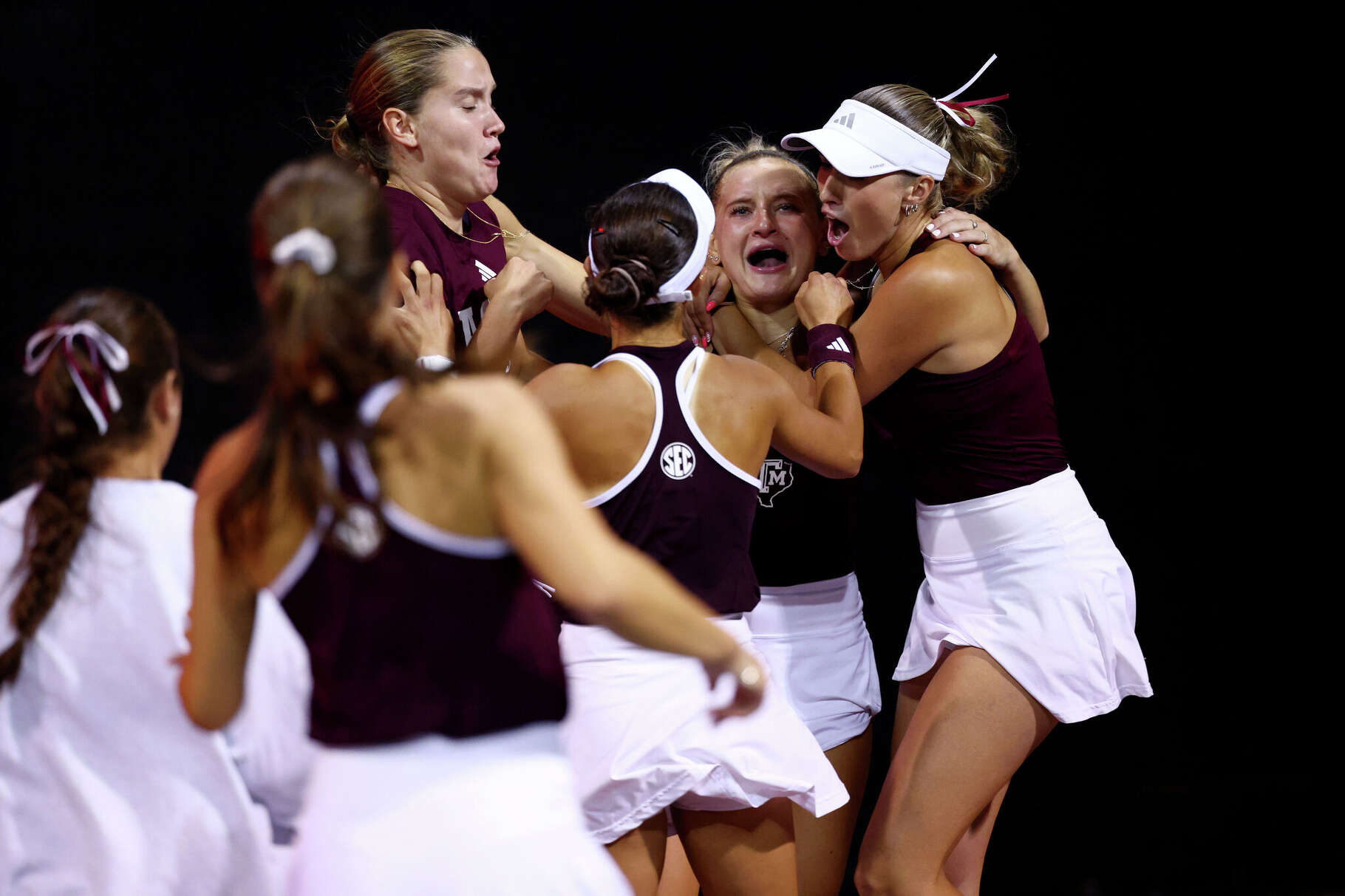 Teammates celebrate with Daria Smetannikov of the Texas A&M Aggies after she clinched the championship on court 6 against the Auburn Tigers during the NCAA Division I Women's Tennis Championship held at the Dan Magill Tennis Complex on May 17, 2026 in Athens, Georgia.