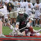 Guilford's Aidan Connelly (22) and Hand's John Healy (21) got for the ball during a scrum during the Class M boys lacrosse final at Fairfield University on Saturday, June 14, 2025.