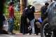People embrace near the scene of a shooting outside the Islamic Center of San Diego Monday, May 18, 2026, in San Diego.