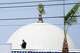 Police stage on a roof at the scene of a shooting outside the Islamic Center of San Diego Monday, May 18, 2026, in San Diego.