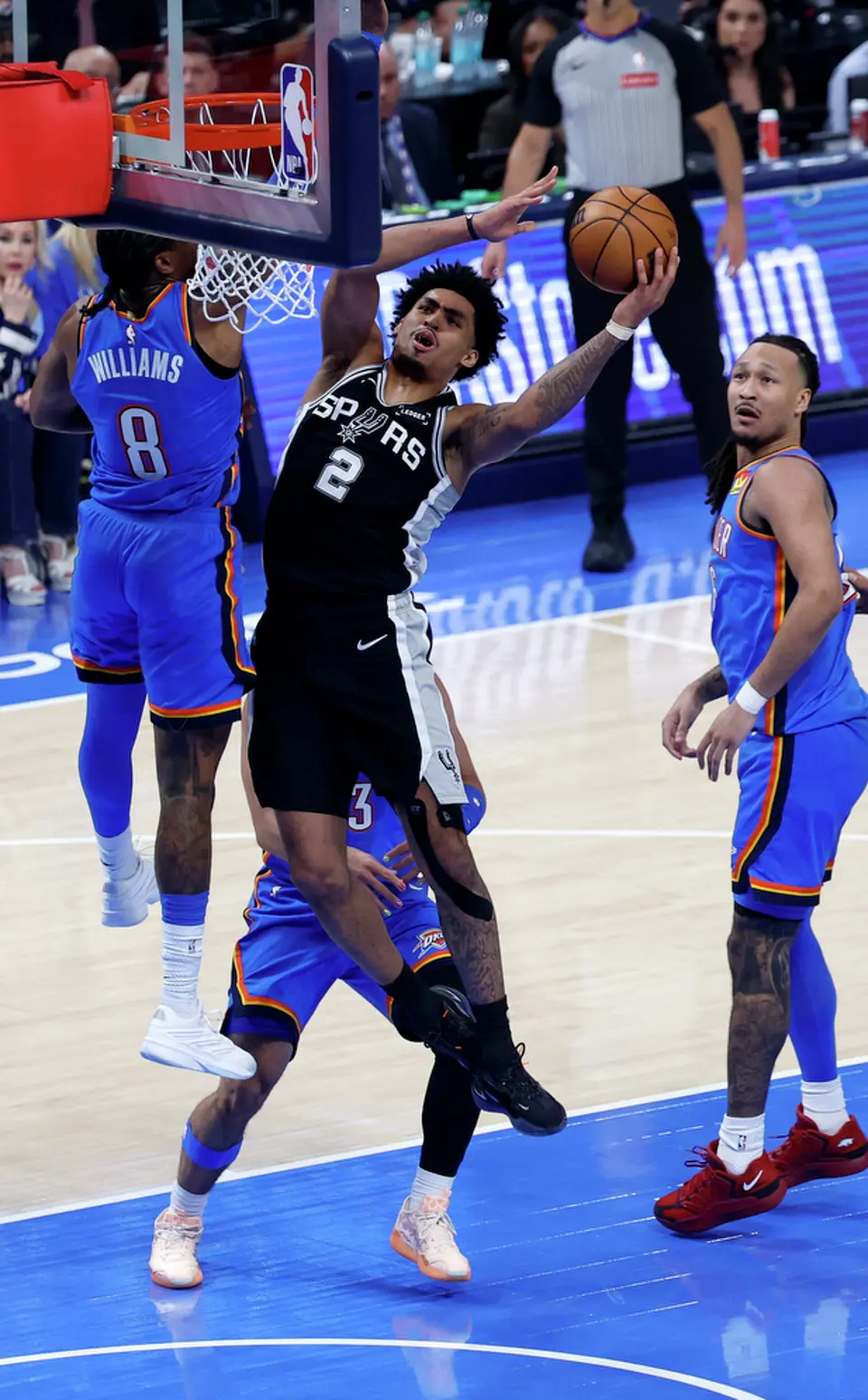 San Antonio Spurs guard Dylan Harper (2) drives to the basket during the first half of Game 1 of the Western Conference Finals at Paycom Center in Oklahoma City, Monday, May 18, 2026.
