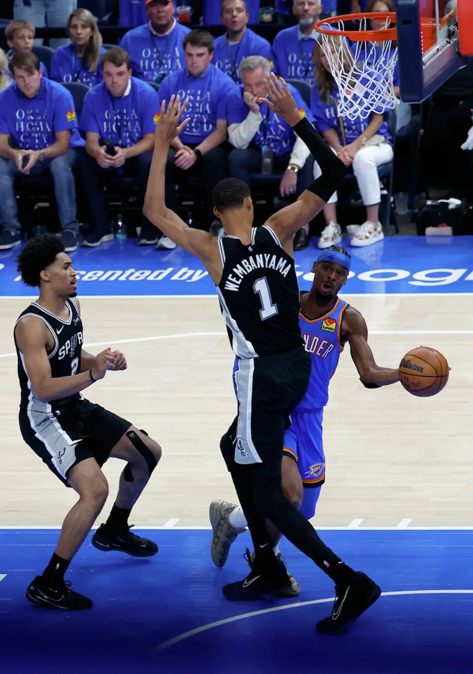 Oklahoma City Thunder guard Shai Gilgeous-Alexander (2) passes the ball behind San Antonio Spurs forward Victor Wembanyama (1) during the first half of Game 1 of the Western Conference Finals at Paycom Center in Oklahoma City, Monday, May 18, 2026.