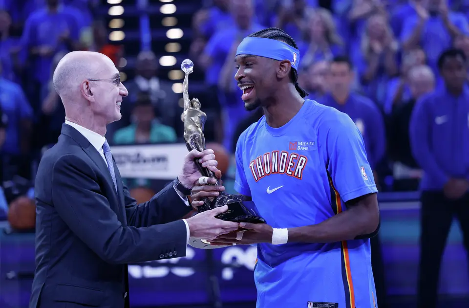Oklahoma City Thunder guard Shai Gilgeous-Alexander (2) accepts the NBA most valuable player trophy before Game 1 of the Western Conference Finals between the Oklahoma City Thunder and the San Antonio Spurs at Paycom Center in Oklahoma City, Monday, May 18, 2026.