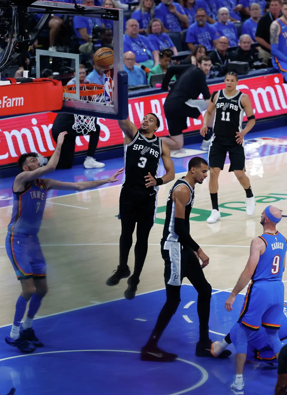 San Antonio Spurs forward Keldon Johnson (3) gets the dunk during the first half of Game 1 of the Western Conference Finals at Paycom Center in Oklahoma City, Monday, May 18, 2026.