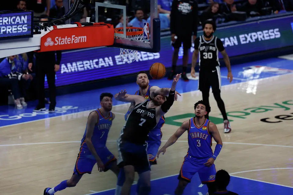 San Antonio Spurs center Luke Kornet (7) is fouled by Oklahoma City Thunder center Isaiah Hartenstein (55) during the first half of Game 1 of the Western Conference Finals at Paycom Center in Oklahoma City, Monday, May 18, 2026.