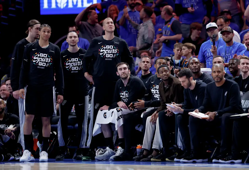 The San Antonio Spurs watch the game action during the third quarter of Game 1 of the Western Conference Finals at Paycom Center in Oklahoma City, Monday, May 18, 2026.