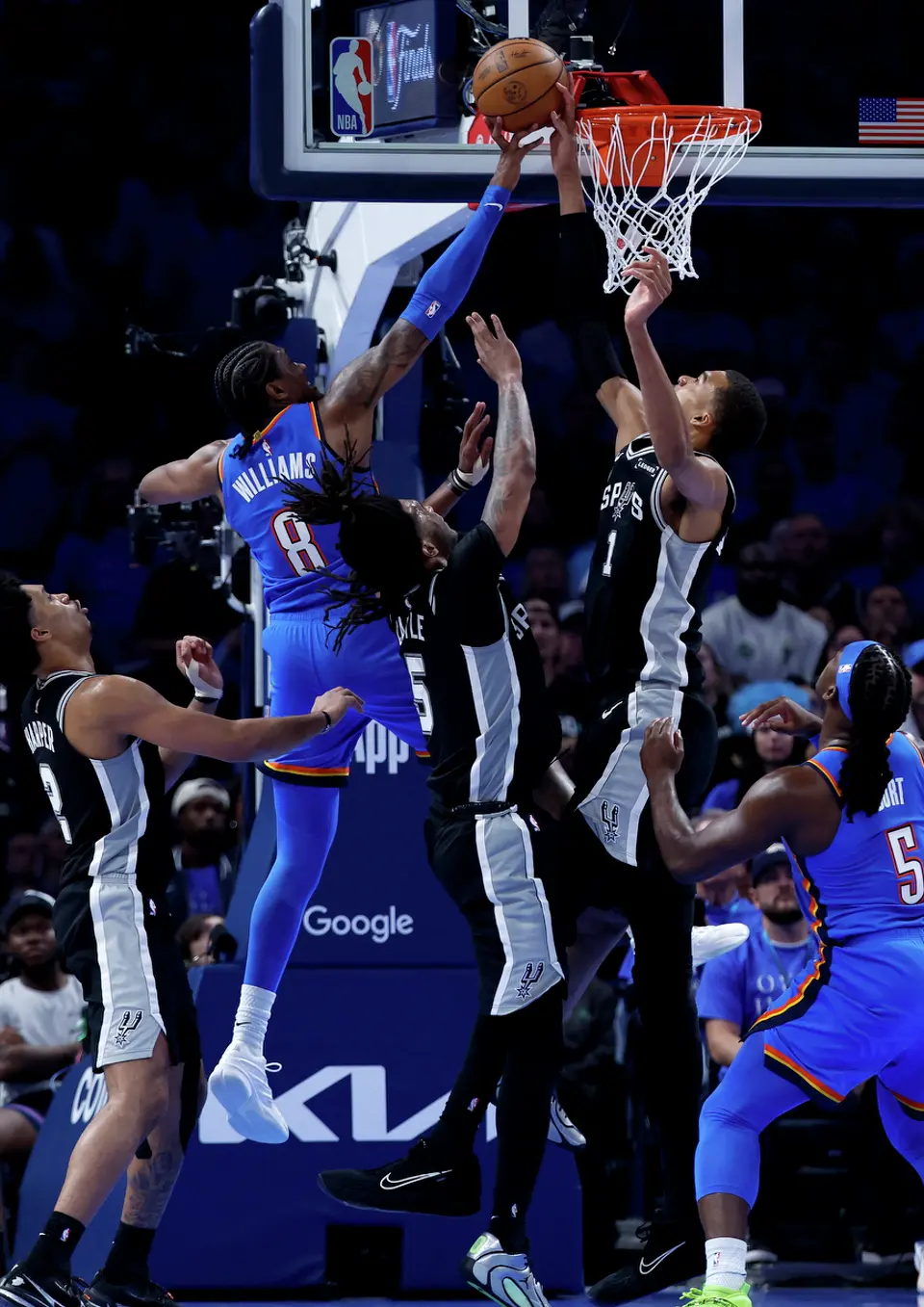 San Antonio Spurs forward Victor Wembanyama (1) blocks the shot of Oklahoma City Thunder guard Jalen Williams (8) during the third quarter of Game 1 of the Western Conference Finals at Paycom Center in Oklahoma City, Monday, May 18, 2026.