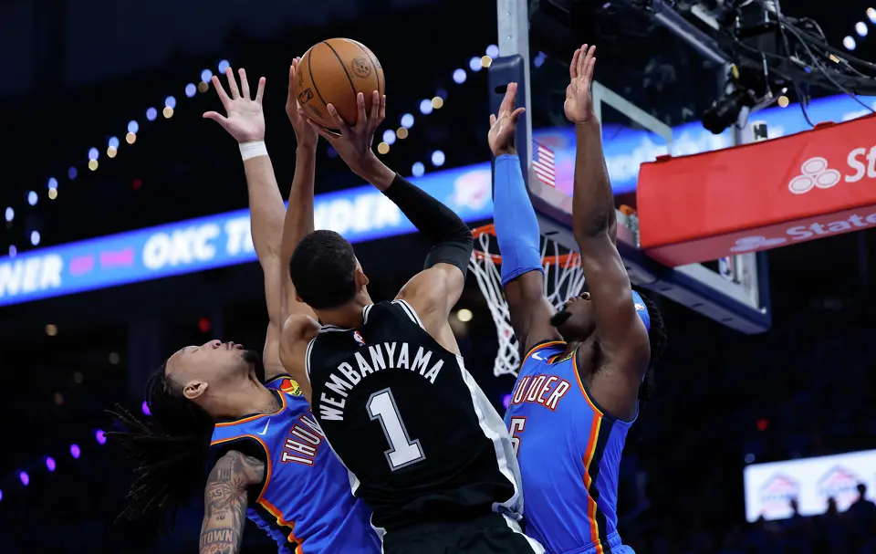 The Oklahoma City Thunder double team San Antonio Spurs forward Victor Wembanyama (1) as he tries to make a shot during the third quarter of Game 1 of the Western Conference Finals at Paycom Center in Oklahoma City, Monday, May 18, 2026.