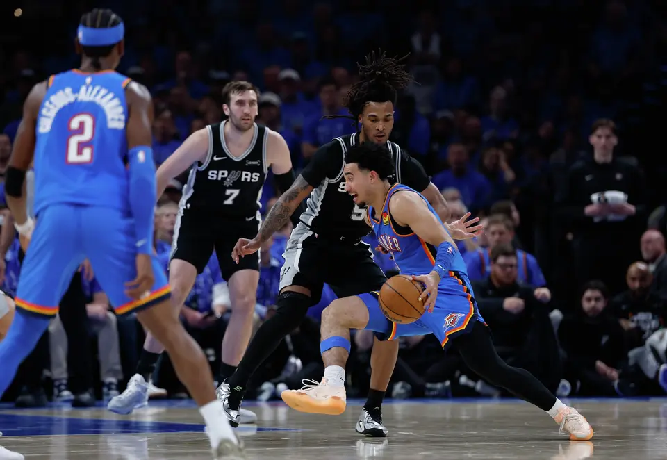Oklahoma City Thunder guard Jared McCain (3) drives to the hoop as San Antonio Spurs guard Stephon Castle (5) defends him.during the third quarter of Game 1 of the Western Conference Finals at Paycom Center in Oklahoma City, Monday, May 18, 2026.