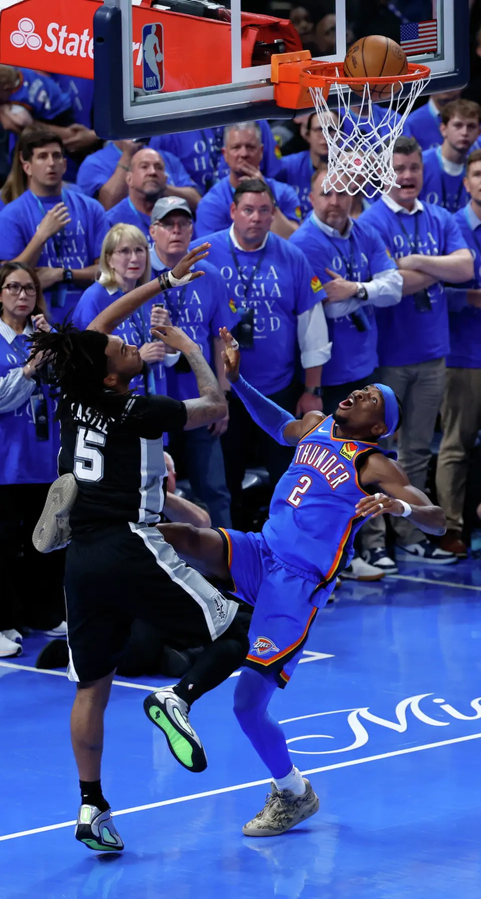 Oklahoma City Thunder guard Shai Gilgeous-Alexander (2) makes a basket over San Antonio Spurs guard Stephon Castle (5) during the second half of Game 1 of the Western Conference Finals at Paycom Center in Oklahoma City, Monday, May 18, 2026. The Spurs defeated the Thunder 122-115 in double overtime.