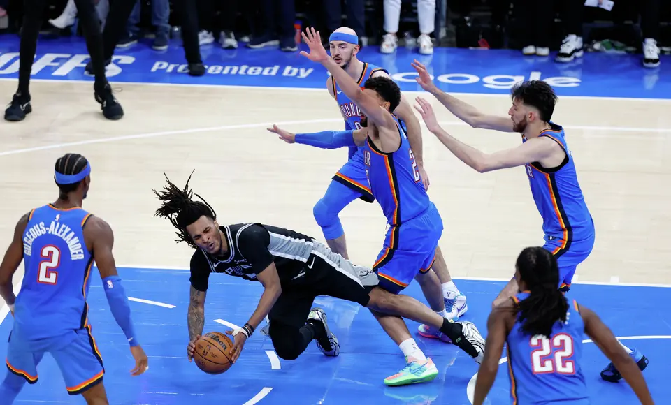 San Antonio Spurs guard Stephon Castle (5) is fouled while driving to the basket during the second half of Game 1 of the Western Conference Finals at Paycom Center in Oklahoma City, Monday, May 18, 2026. The Spurs defeated the Thunder 122-115 in double overtime.