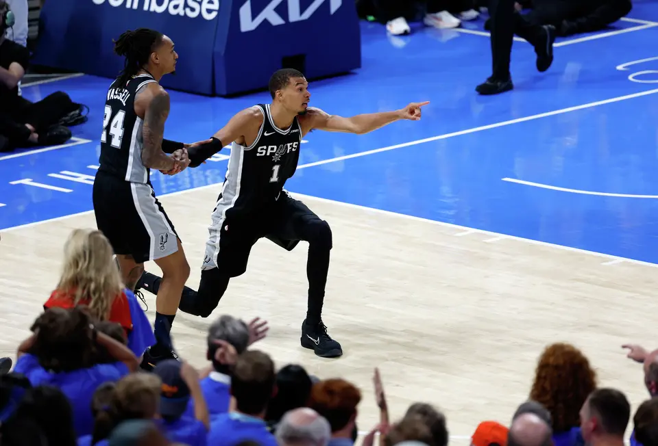 San Antonio Spurs forward Victor Wembanyama (1) points towards the Spurs basket indicating possession after a loose ball scramble during the second half of Game 1 of the Western Conference Finals at Paycom Center in Oklahoma City, Monday, May 18, 2026. The Spurs defeated the Thunder 122-115 in double overtime.