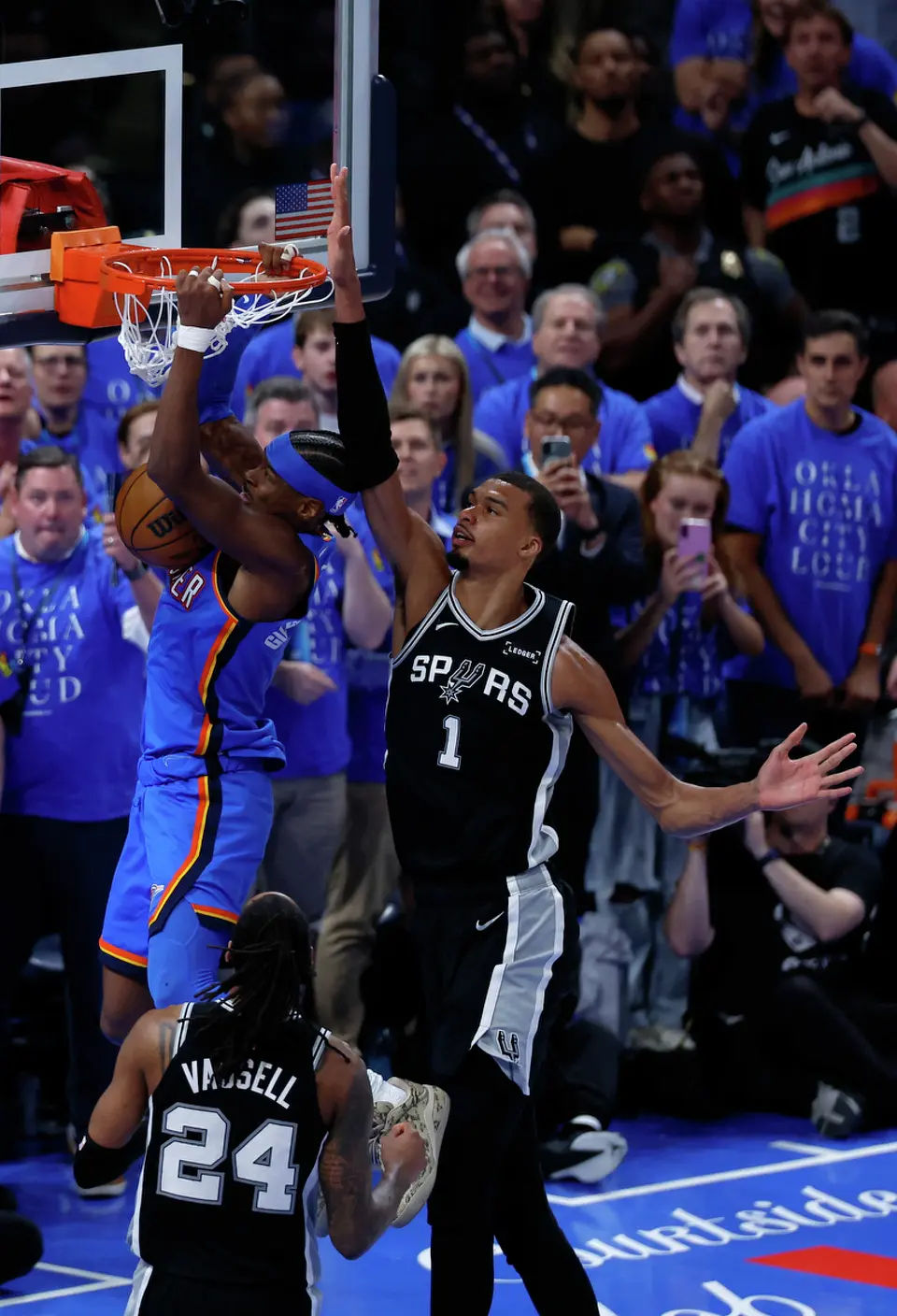 Oklahoma City Thunder guard Shai Gilgeous-Alexander (2) gets a dunk past San Antonio Spurs forward Victor Wembanyama (1) during the second half of Game 1 of the Western Conference Finals at Paycom Center in Oklahoma City, Monday, May 18, 2026. The Spurs defeated the Thunder 122-115 in double overtime.