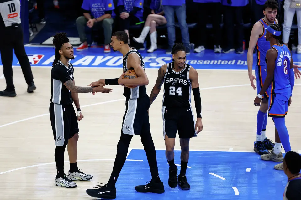 San Antonio Spurs guard Stephon Castle (5) slaps hands with San Antonio Spurs forward Victor Wembanyama (1) after Wembanyama was fouled while scoring a basket during the second half of Game 1 of the Western Conference Finals at Paycom Center in Oklahoma City, Monday, May 18, 2026. The Spurs defeated the Thunder 122-115 in double overtime.