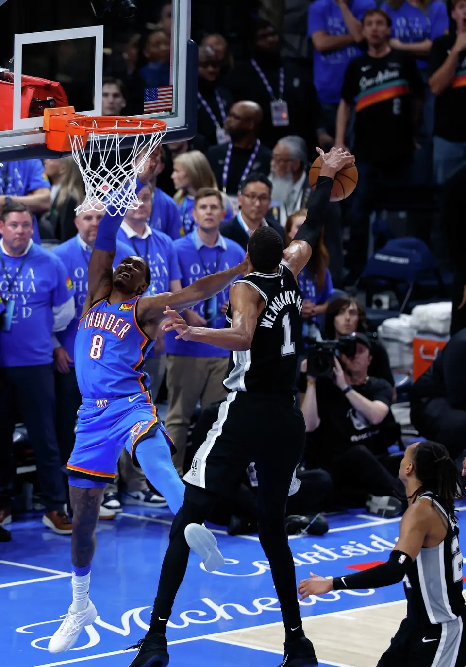 San Antonio Spurs forward Victor Wembanyama (1) gets a key blocked shot on Oklahoma City Thunder guard Jalen Williams (8) in double overtime of Game 1 of the Western Conference Finals at Paycom Center in Oklahoma City, Monday, May 18, 2026. The Spurs defeated the Thunder 122-115 in double overtime.