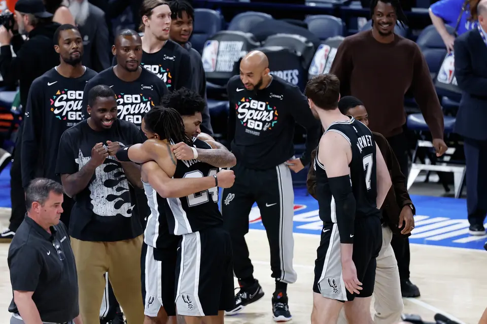 San Antonio Spurs guard Dylan Harper (2) and San Antonio Spurs guard Devin Vassell (24) hug in celebration after defeating the Thunder in Game 1 of the Western Conference Finals at Paycom Center in Oklahoma City, Monday, May 18, 2026. The Spurs defeated Oklahoma City 122-115 in double overtime.