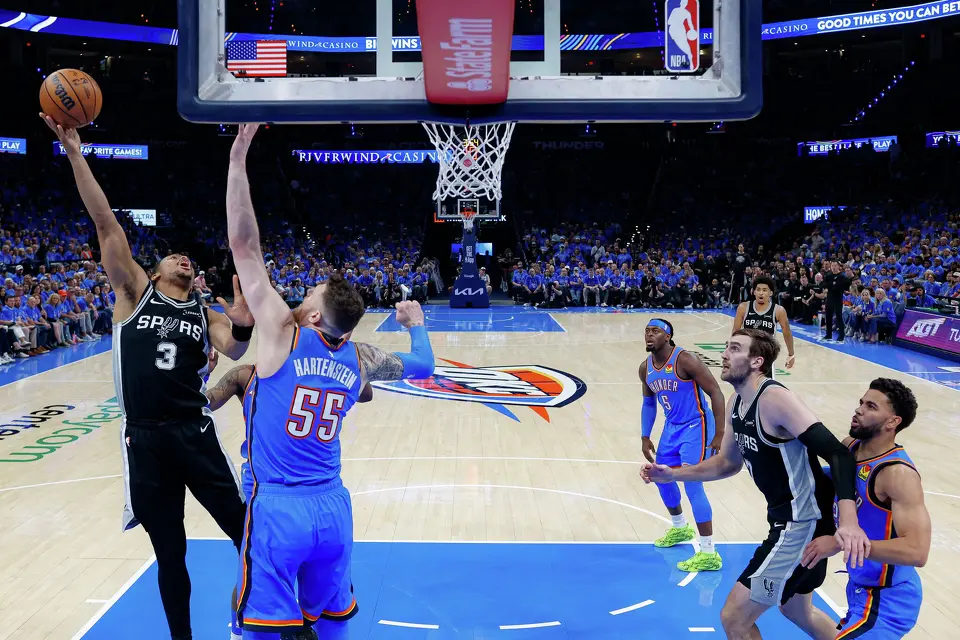 San Antonio Spurs forward Keldon Johnson (3) shoots over Oklahoma City Thunder center Isaiah Hartenstein (55) during Game 1 of the Western Conference Finals at Paycom Center in Oklahoma City, Monday, May 18, 2026. The Spurs defeated the Thunder 122-115 in double overtime.