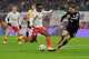 FILE - Leipzig's Yan Diomande, centre, and Bayern's Leon Goretzka challenge for the ball during the Bundesliga soccer match between RB Leipzig and FC Bayern Munich in Leipzig, Germany, on Jan. 17, 2026.