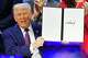 FILE - President Donald Trump holds the charter during a signing ceremony on his Board of Peace initiative at the Annual Meeting of the World Economic Forum in Davos, Switzerland, Jan. 22, 2026.