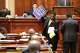 Democratic South Carolina Rep. Wendell Gillard walks back to his desk with a sign after giving a speech during the redistricting debate on Tuesday. May 19, 2026, in Columbia, S.C.