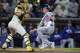 Los Angeles Dodgers' Alex Call, right, scores from third off a sacrifice fly by Andy Pages as San Diego Padres catcher Freddy Fermin is late with the catch during the ninth inning of a baseball game Tuesday, May 19, 2026, in San Diego.
