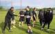 Jameson Baker (center) of the Golden Knights flag football team meets a player from the Michigan Arsenal arena football team on May 18, 2026 outside Midland High School. The Arsenal came from Saginaw to practice with the Golden Knights, who are preparing to compete at the Special Olympics USA Games in Minnesota in June.