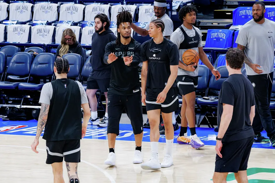 San Antonio Spurs guard Stephon Castle, center left, talks to forward Carter Bryant during shootaround at Paycom Center in Oklahoma City, Wednesday, May 20, 2026, as the team prepares for Game 2 of the Western Conference Finals against the Oklahoma City Thunder. The Spurs defeated the Thunder 122-115 in double overtime in Game 1 and are now leading the series 1-0.
