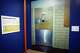A view of a large photo reproduction of trauma room one, including the original number placard, from Parkland Memorial Hospital where President Kennedy died, “On Assignment: Dallas Times Herald 1963” exhibit at the Sixth Floor Museum on Wednesday, May 20, 2026, in Dallas.