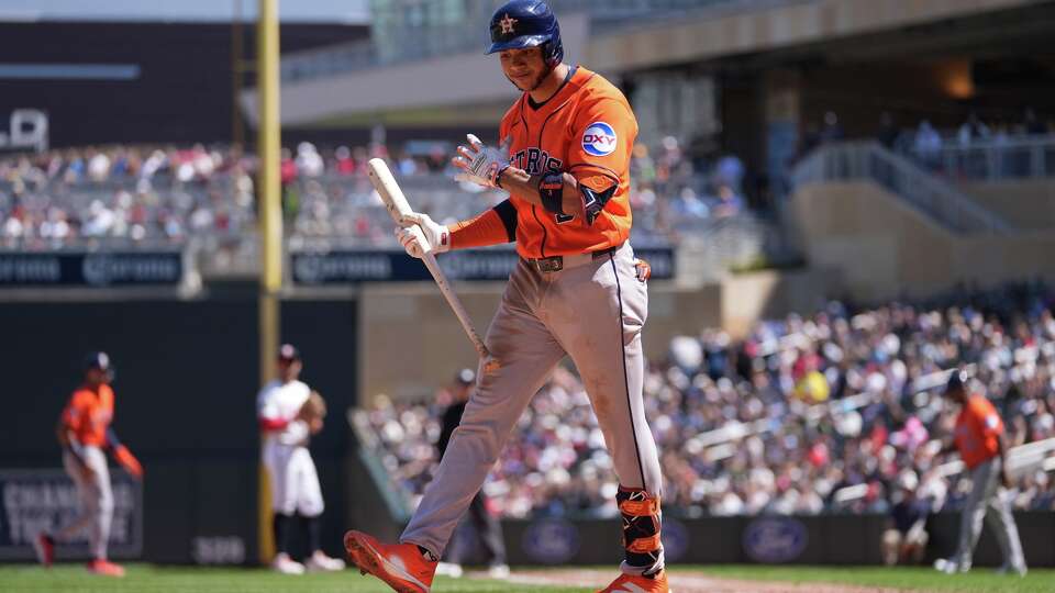 Houston Astros' Jeremy Peña walks back to the dugout after striking out in the eighth inning of a baseball game against the Minnesota Twins, Wednesday, May 20, 2026, in Minneapolis. (AP Photo/Abbie Parr)