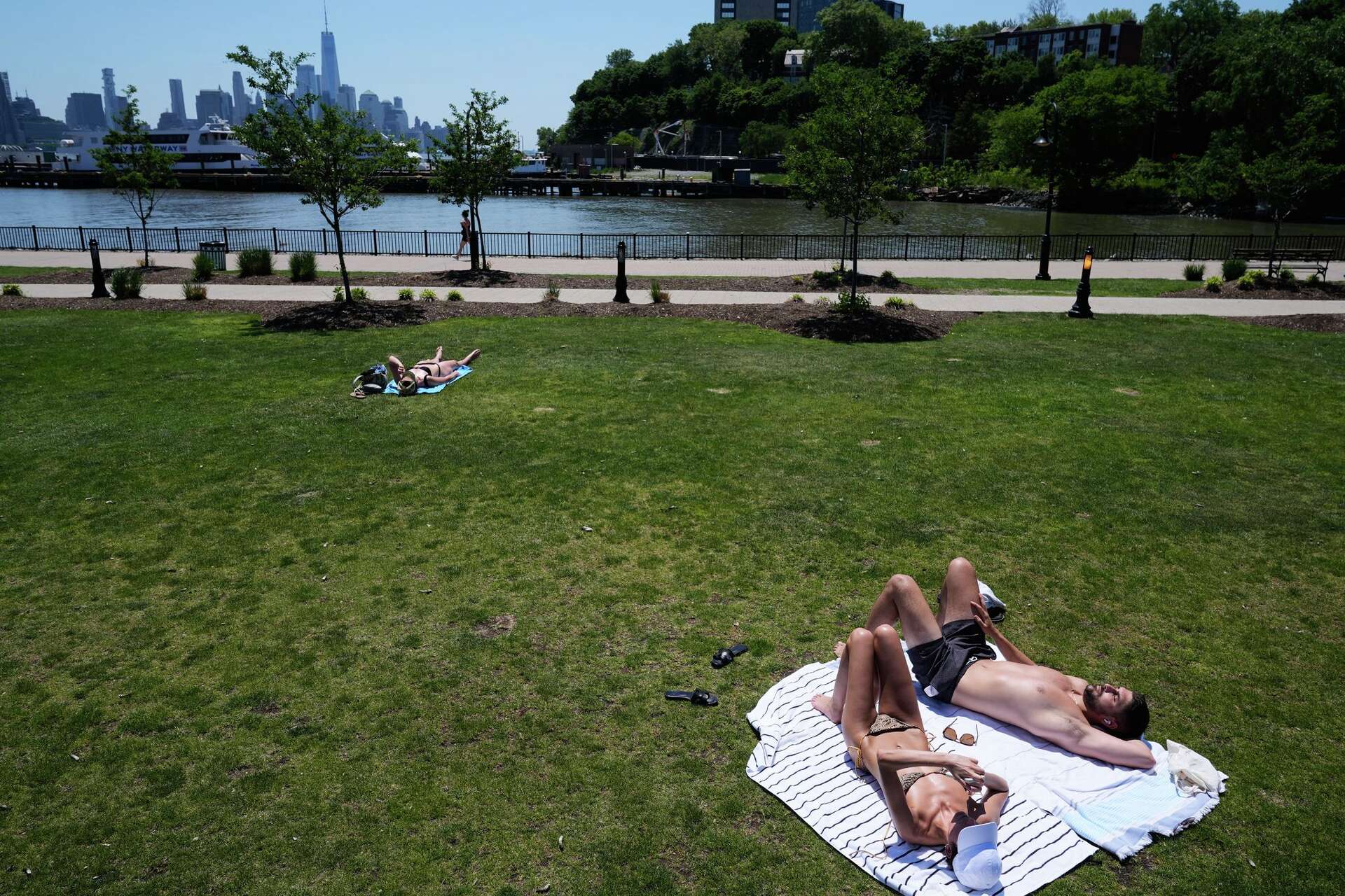 Eastern US sweats through another hot day before rain, cold move in
