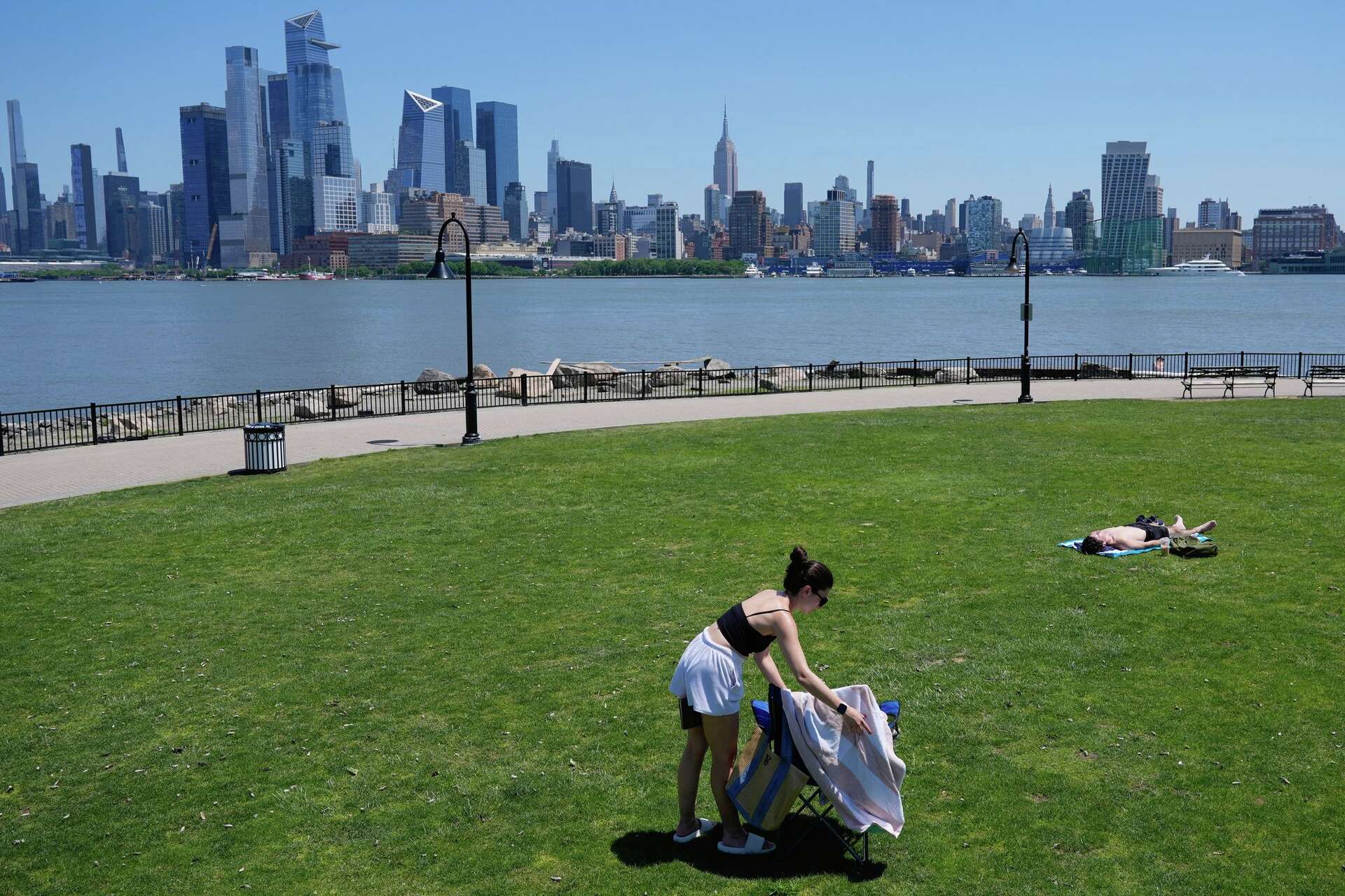 Eastern US sweats through another hot day before rain, cold move in