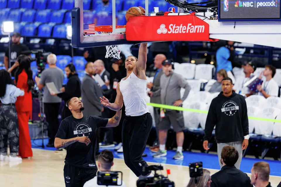 San Antonio Spurs forward Carter Bryant (11) lays the ball in during a pre-game warmup before Game 2 of the Western Conference Finals against the Oklahoma City Thunder at Paycom Center in Oklahoma City, Wednesday, May 20, 2026.