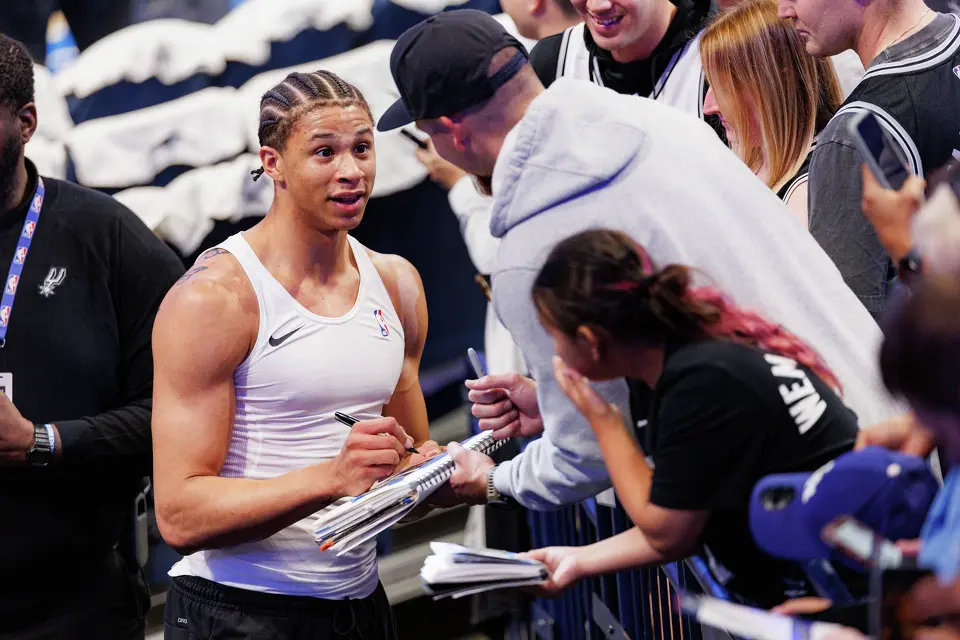 San Antonio Spurs forward Carter Bryant signs autographs for fans before Game 2 of the Western Conference Finals against the Oklahoma City Thunder at Paycom Center in Oklahoma City, Wednesday, May 20, 2026.