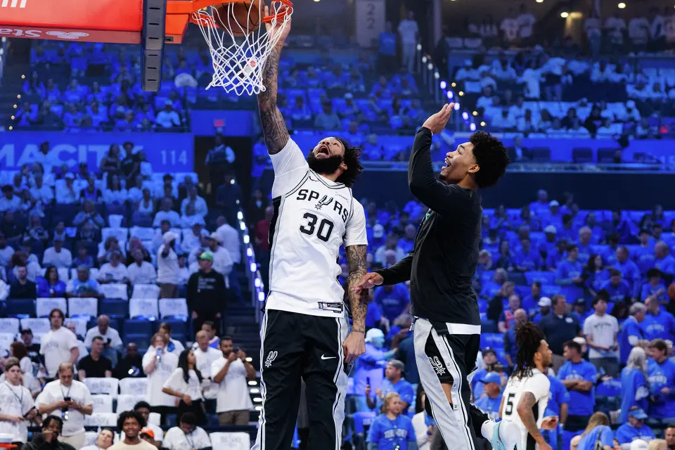 San Antonio Spurs forward Julian Champagnie (30) and guard Dylan Harper (2) warm up before Game 2 of the Western Conference Finals at Paycom Center in Oklahoma City, Wednesday, May 20, 2026.